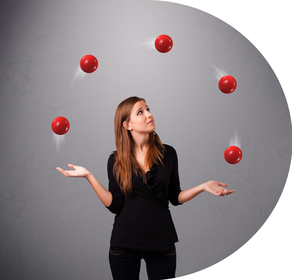 Staying agile: a woman juggling five red balls.